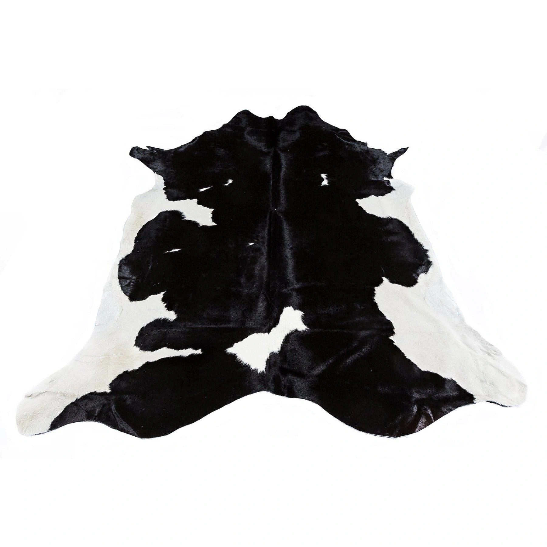Friesian Black Cowhide Rug: Striking Black & White Beauty – Luxury & Style.
